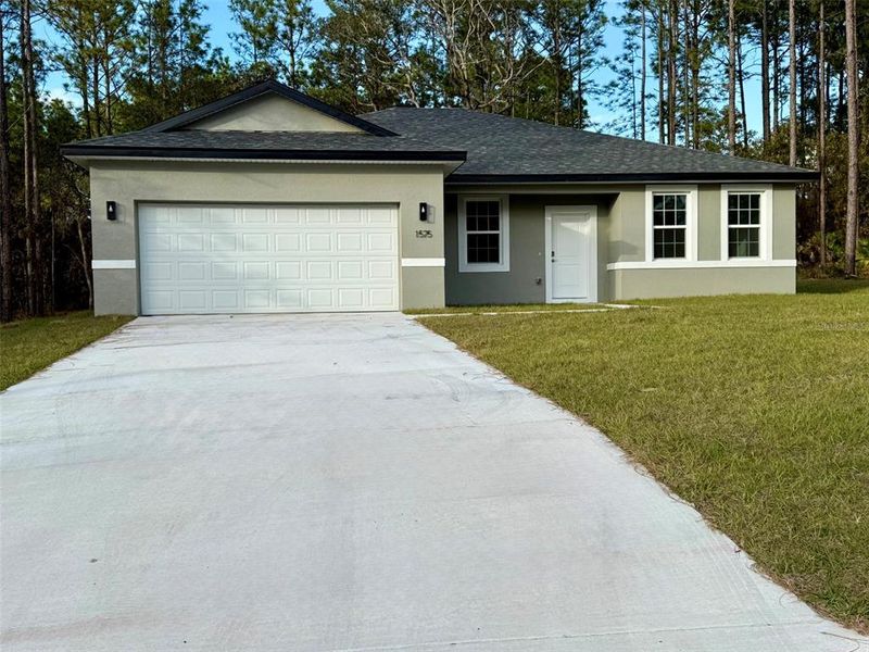 Front exterior of a new home in , Citrus Springs, FL, highlighting curb appeal (Image 30).