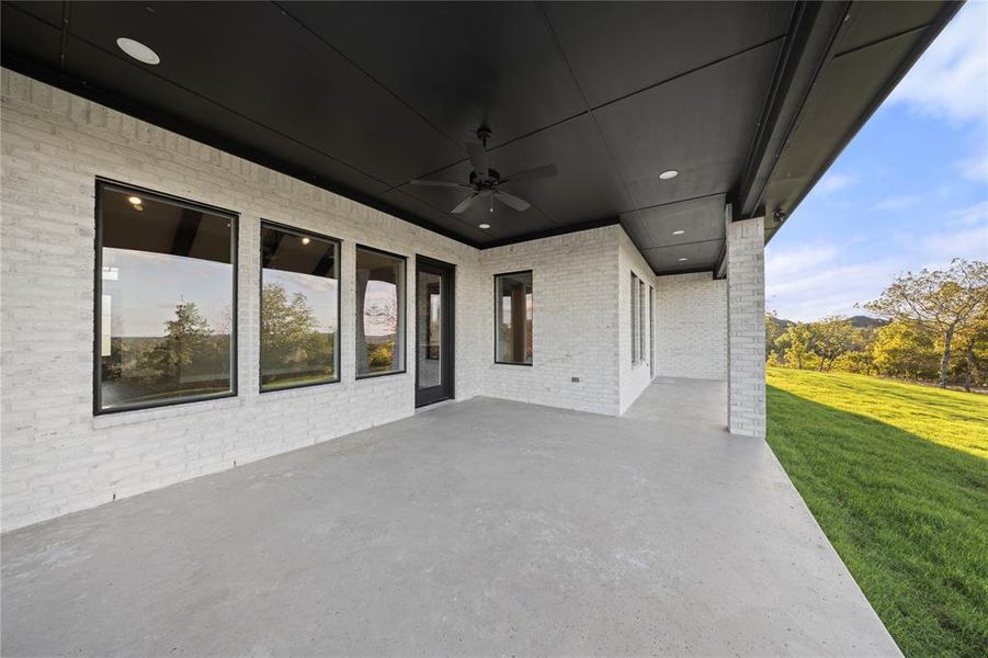 View of patio featuring ceiling fan