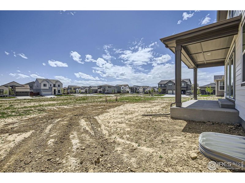 Exterior details and patio area of a home in RainDance, Windsor (Image 18).