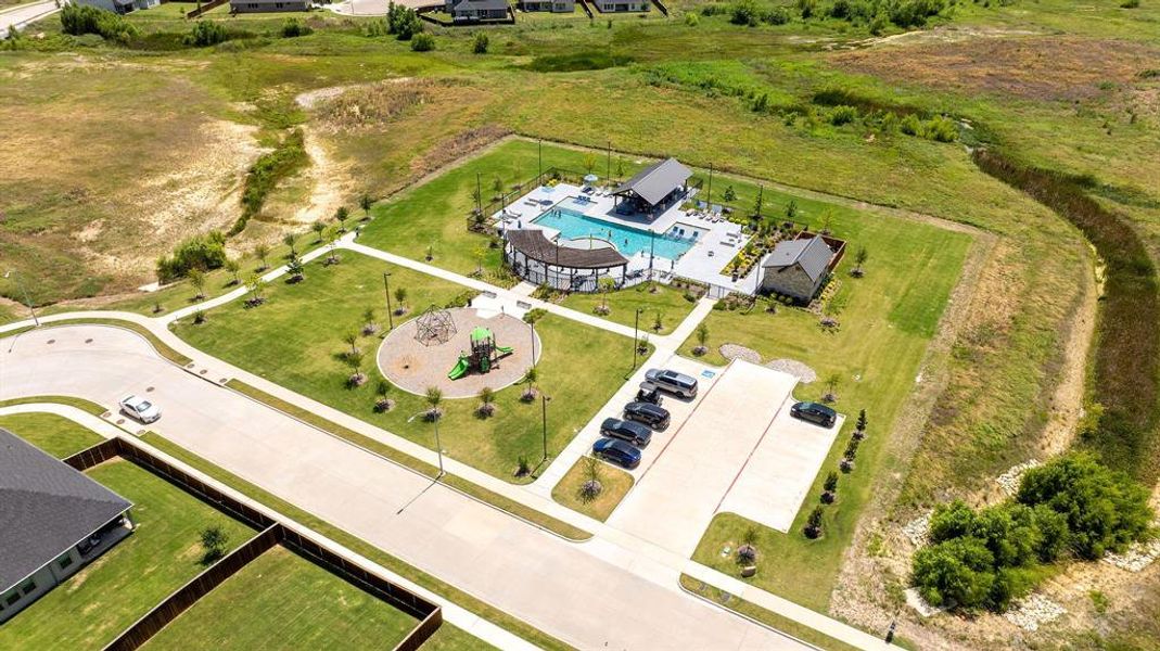 Community amenity center featuring a swimming pool, covered lounge areas, and a dedicated playground Community amenity center featuring a swimming pool, covered lounge areas, and a dedicated playground