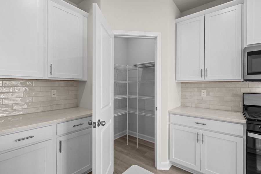 Furnished interior view inside a new home in Cypress Ridge - The Coastline Series, Longs (Image 12).