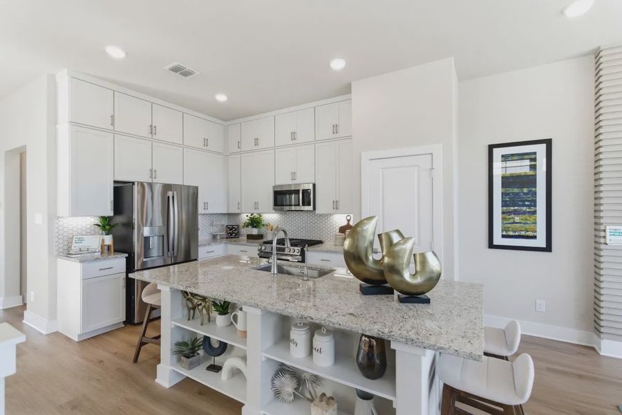 Furnished interior view inside a new home in Centero at Stone Oak, San Antonio (Image 5).