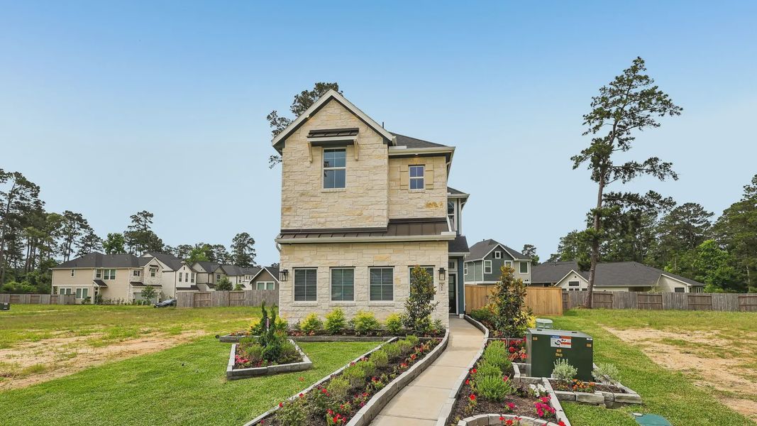 Representative exterior photo of a completed home built from the Cheverny by Chesmar Homes in The Woodland Hills Chateau, Willis, TX (Image 1). Representative exterior photo of a completed home built from the Cheverny by Chesmar Homes in The Woodland Hills Chateau, Willis, TX (Image 1).