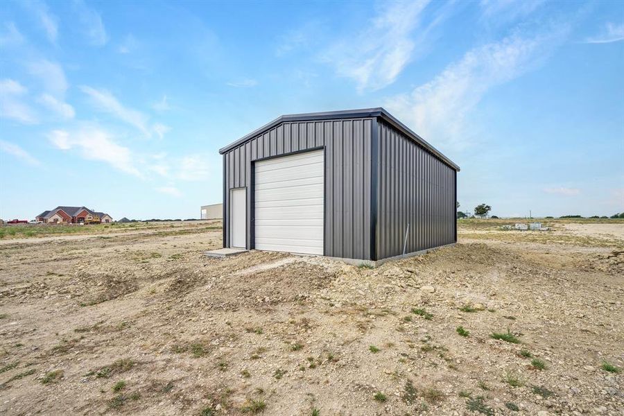 Shop has electric with 10x10 garage door with opener.