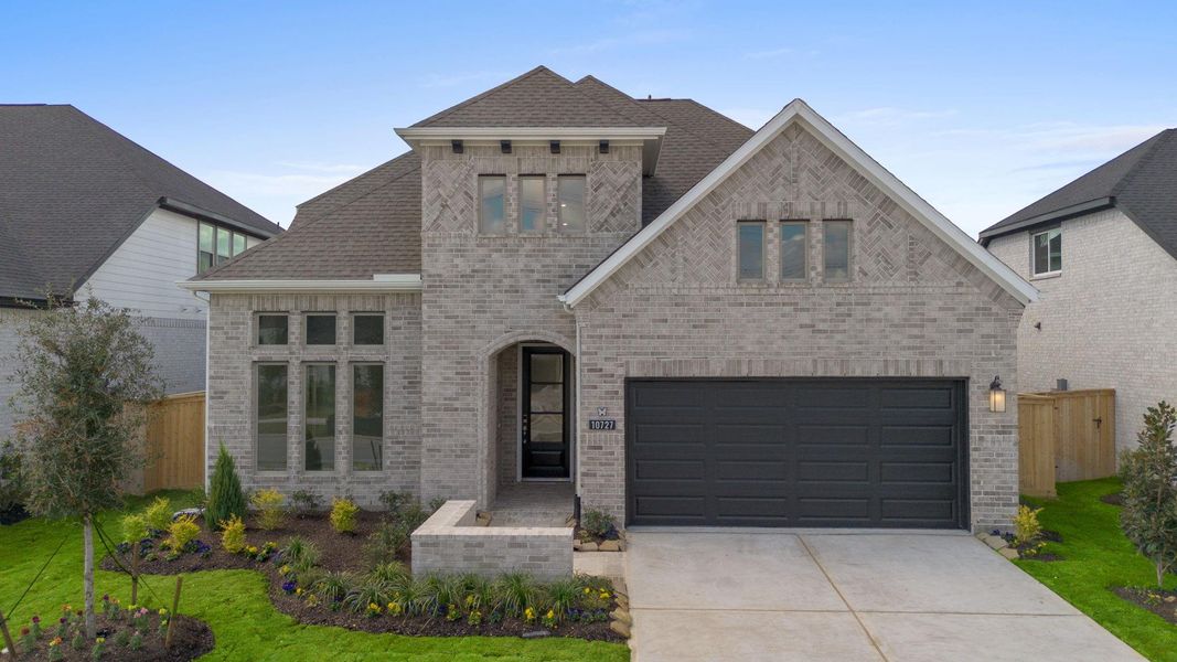Front exterior of a new home in Bridgeland 55', Cypress, TX, highlighting curb appeal (Image 19).