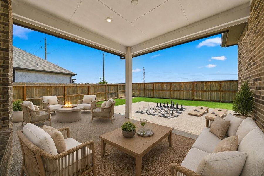 Covered patio with epoxy finish offers a low maintenance outdoor retreat. *Photo is virtually staged* Covered patio with epoxy finish offers a low maintenance outdoor retreat. *Photo is virtually staged*