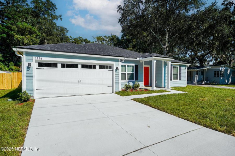 Front exterior of a new home in , Jacksonville, FL, highlighting curb appeal (Image 18).