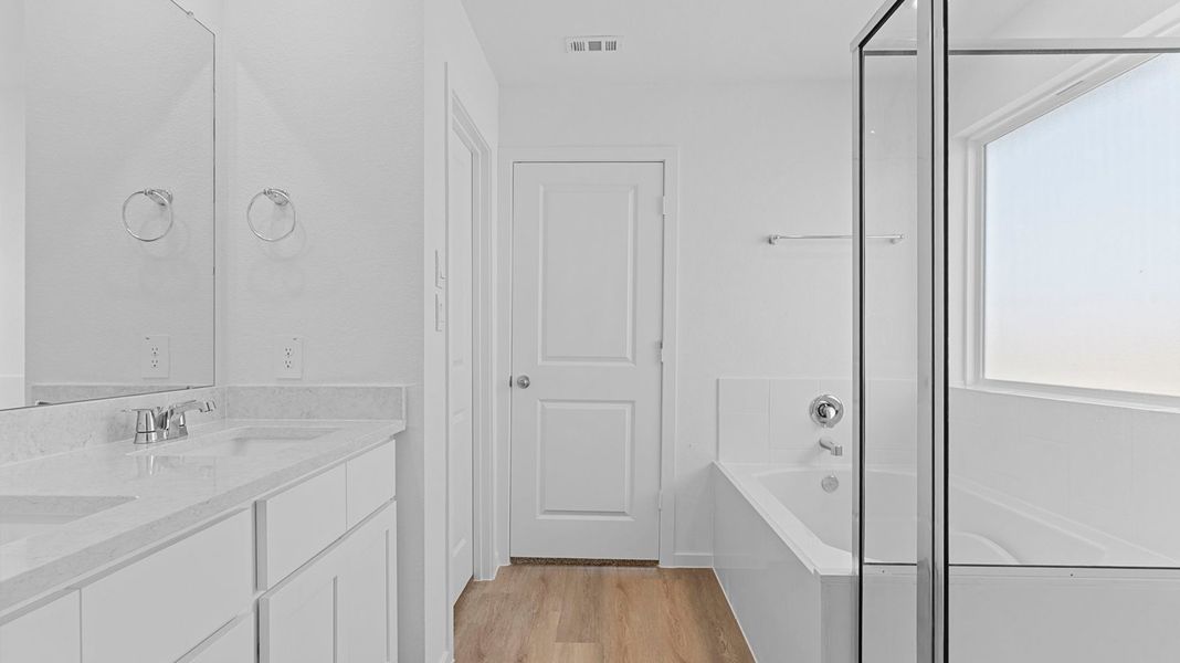 Furnished interior view inside a new home in Caldwell Crossing, Iowa Colony (Image 6).