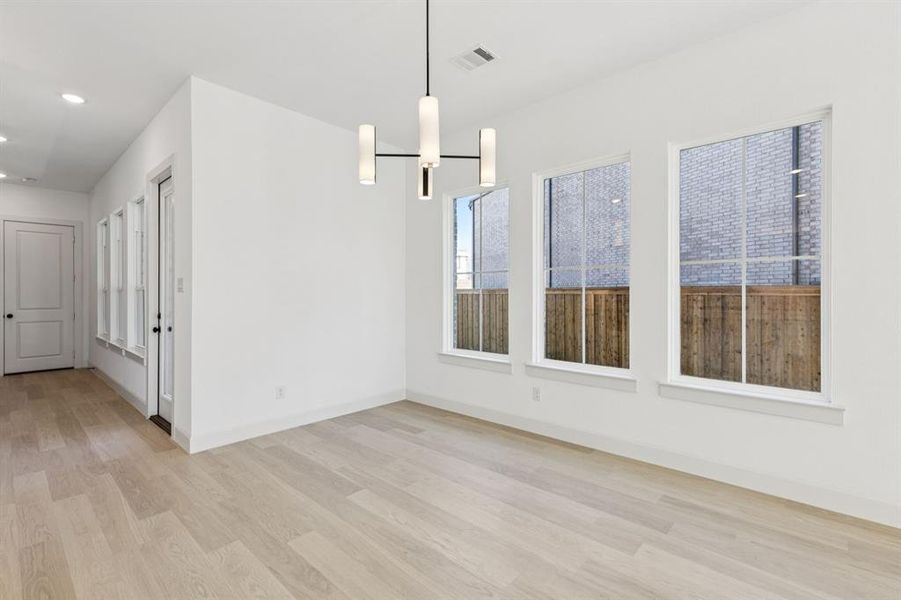 Whether it's grand dinner parties or cozy family meals, this light filled dining room fits all occasions!