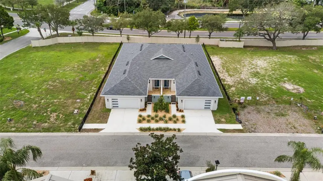 Front exterior of a new home in , Tarpon Springs, FL, highlighting curb appeal (Image 23).