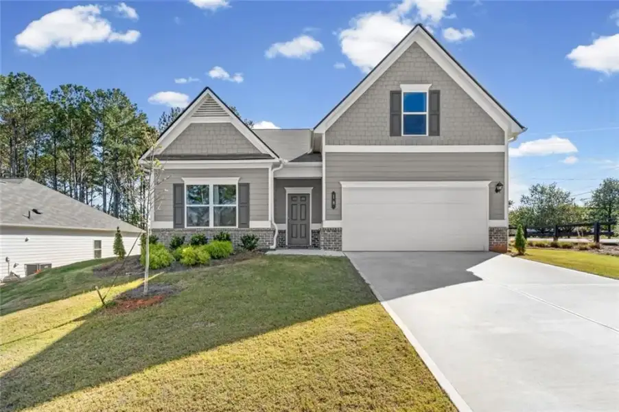 Front exterior of a new home in Allen Manor, Hoschton, GA, highlighting curb appeal (Image 2). Front exterior of a new home in Allen Manor, Hoschton, GA, highlighting curb appeal (Image 2).