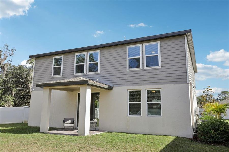 Exterior details and patio area of a home in Fox Pointe at Rivers Edge, Leesburg (Image 28).