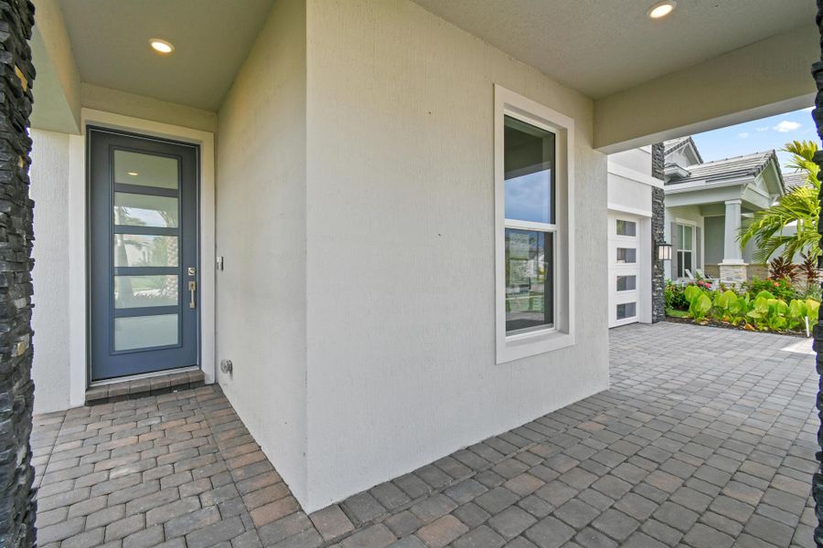 Exterior details and patio area of a home in Avondale at Avenir, Palm Beach Gardens (Image 21).