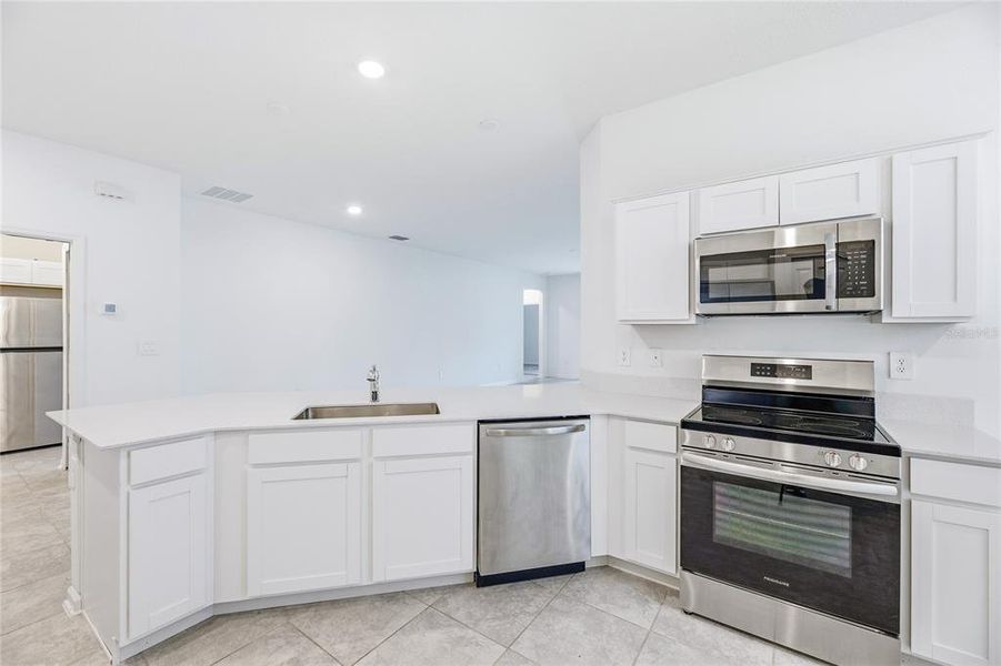 Furnished interior view inside a new home in Peace Creek Reserve, Winter Haven (Image 14).