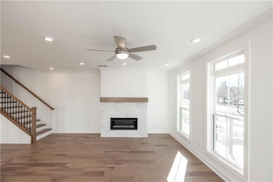 On cooler evenings, you will enjoy the linear fireplace which has stacked quartzite surround and natural box beam mantel