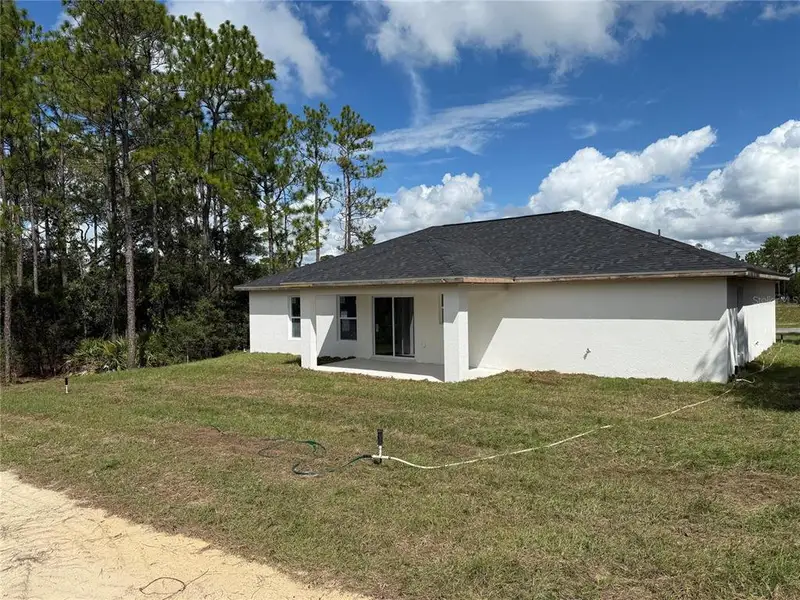 Front exterior of a new home in , Citrus Springs, FL, highlighting curb appeal (Image 16).