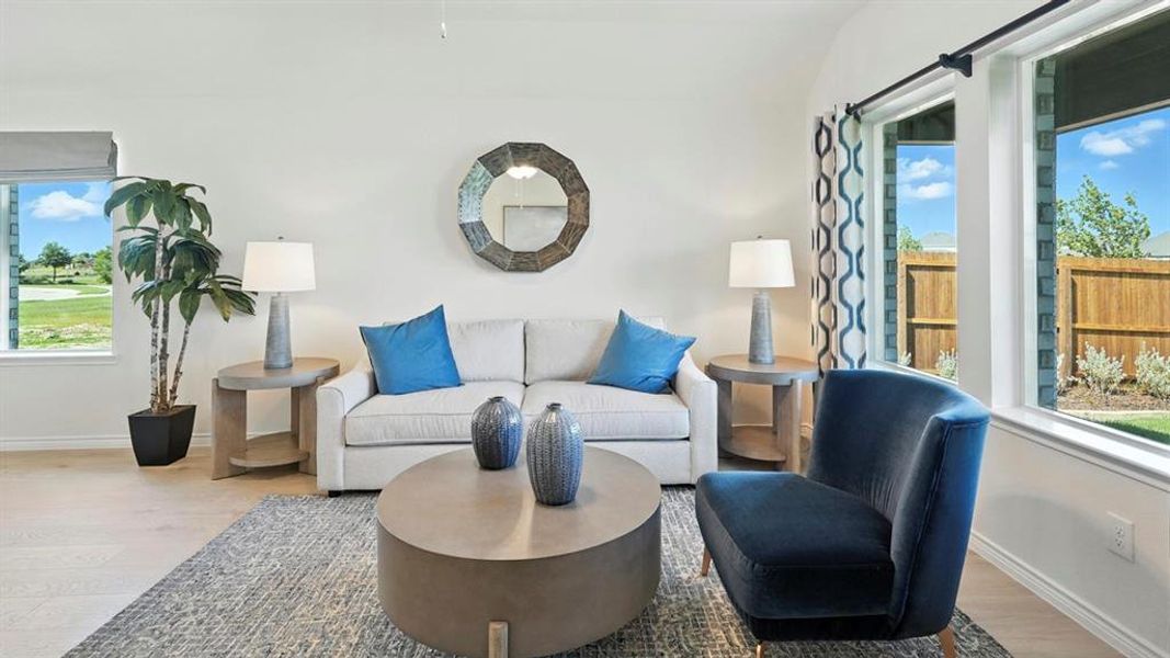 Living area featuring healthy amount of natural light and wood finished floors