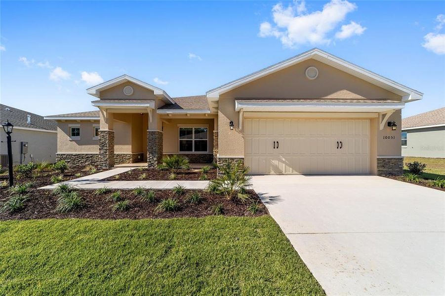 Front exterior of a new home in , Ocala, FL, highlighting curb appeal (Image 2). Front exterior of a new home in , Ocala, FL, highlighting curb appeal (Image 2).
