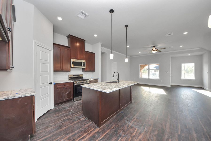 Furnished interior view inside a new home in Hill & Dale Ranch, Splendora (Image 6).