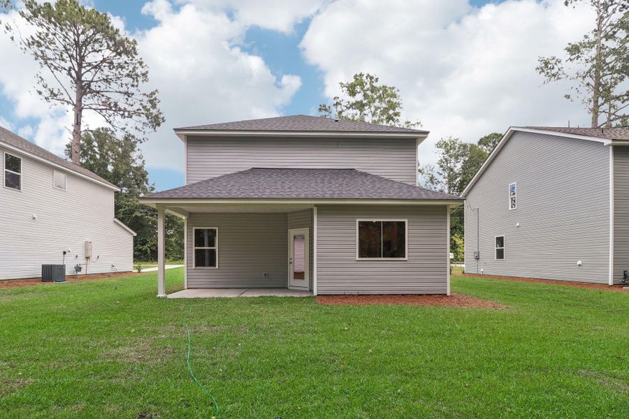 Exterior details and patio area of a home in Founder's Park, Lincolnville (Image 4).