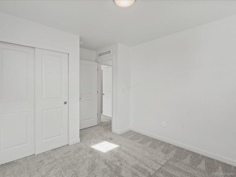 Spacious, unfurnished interior of a new home in The Hub at Virginia Village, Denver (Image 27).
