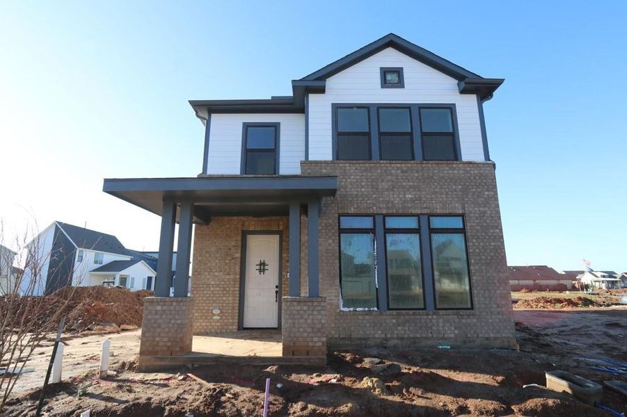 Front exterior of a new home in Indigo 35’ Homesites, Richmond, TX, highlighting curb appeal (Image 1).