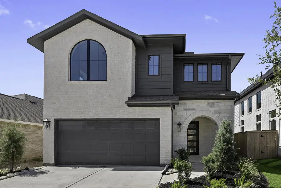 Front exterior of a new home in Candela, Richmond, TX, highlighting curb appeal (Image 18). Front exterior of a new home in Candela, Richmond, TX, highlighting curb appeal (Image 18).