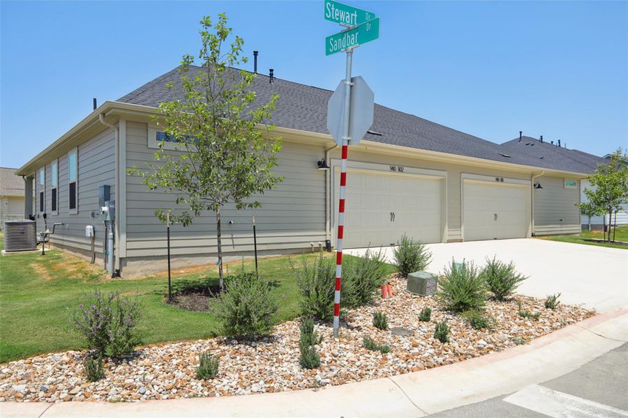 View of front of home featuring driveway, an attached garage, roof with shingles, and a front yard View of front of home featuring driveway, an attached garage, roof with shingles, and a front yard