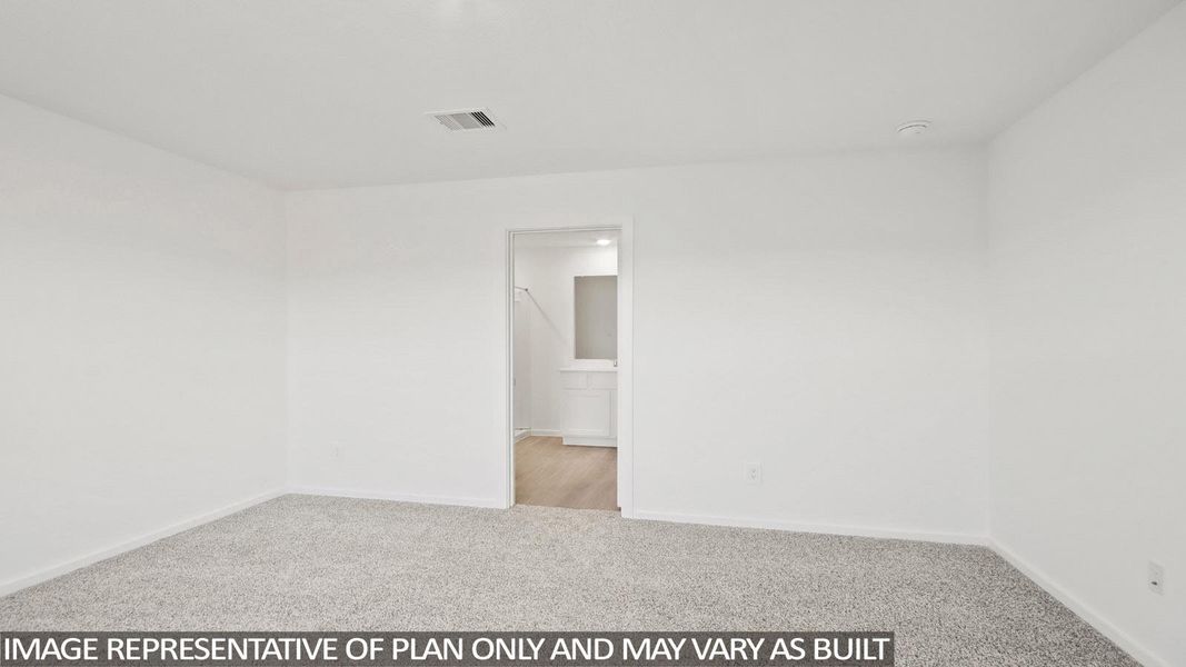 Spacious room featuring light gray carpeting, white walls, and white trim