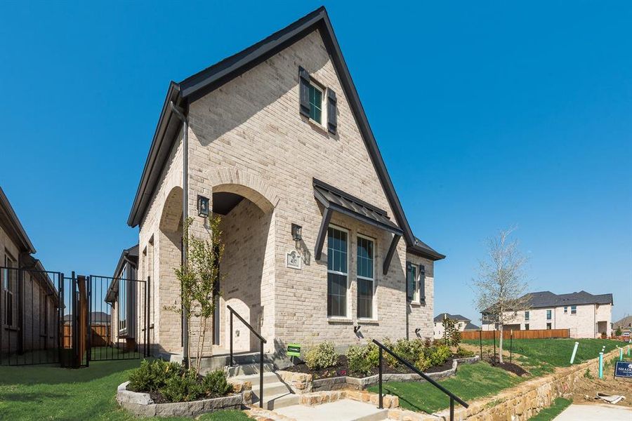 Front exterior of a new home in Cottages of Celina, Celina, TX, highlighting curb appeal (Image 21).