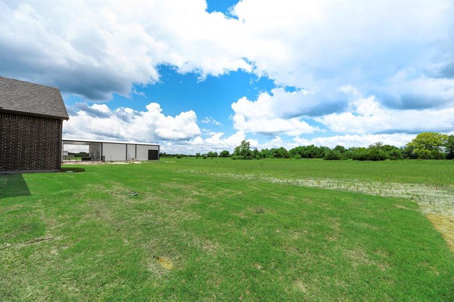 Front exterior of a new home in Fannin Ranch, Leonard, TX, highlighting curb appeal (Image 23). Front exterior of a new home in Fannin Ranch, Leonard, TX, highlighting curb appeal (Image 23).