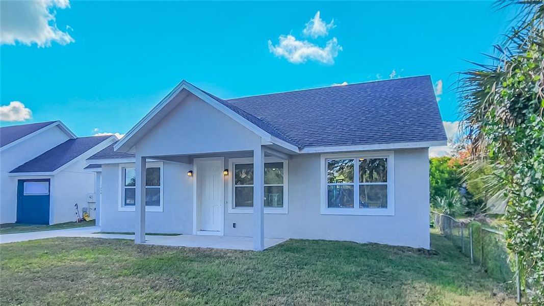 Front exterior of a new home in , Lakeland, FL, highlighting curb appeal (Image 13).