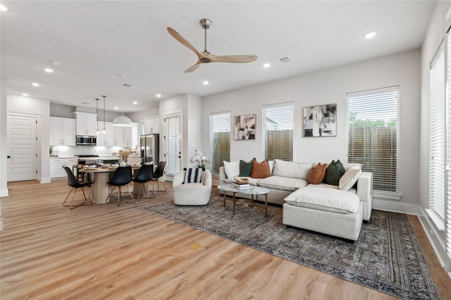 Positioned at the rear of the home, the living room offers a private, light-filled setting with easy access to outdoor space.