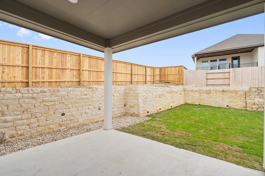 Exterior details and patio area of a home in Park Collection at Lariat, Liberty Hill (Image 28).