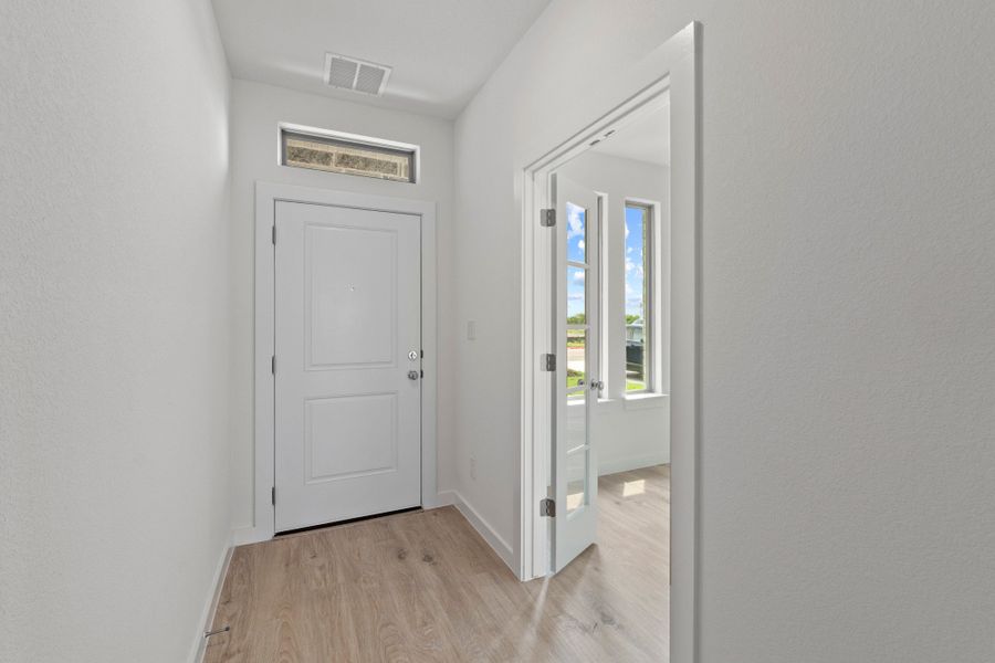 Entry in the Pearl home plan by Trophy Signature Homes – REPRESENTATIVE PHOTO
