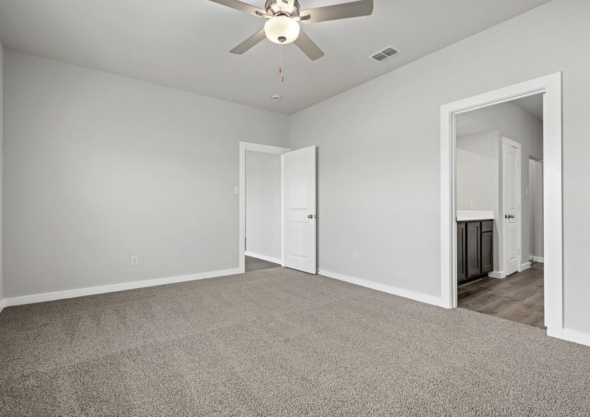 The master suite has a large bedroom, ensuite bathroom and a walk-in closet.