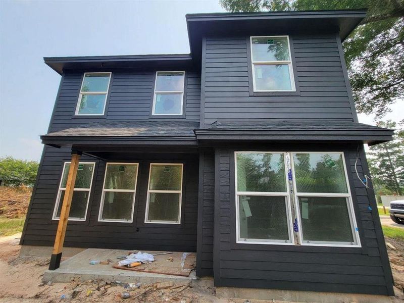 Look all the windows on the back of the house! Lots of natural light and a covered back porch also!