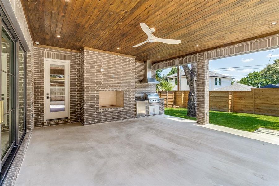 View of patio featuring exterior kitchen and ceiling fan View of patio featuring exterior kitchen and ceiling fan