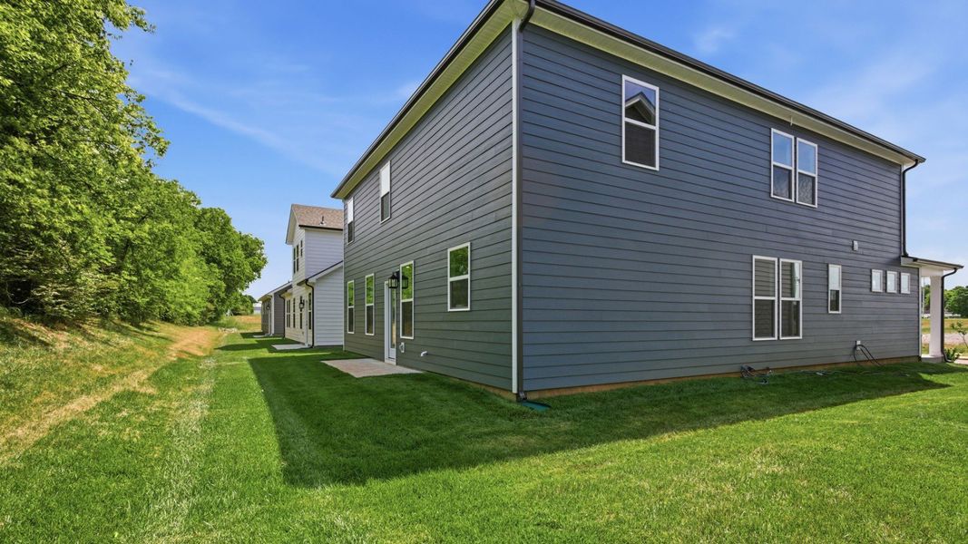 Backyard of home with small back patio Backyard of home with small back patio