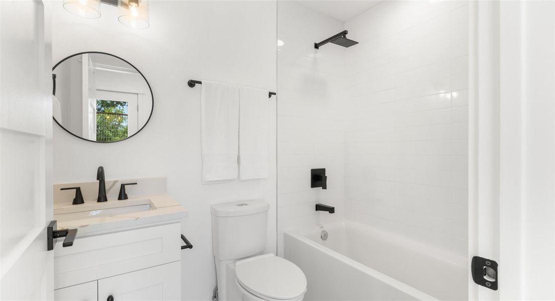 A spa-inspired primary bath with a glass walk-in shower, designed for a relaxing start or end to the day. Model No. 105 Shown.