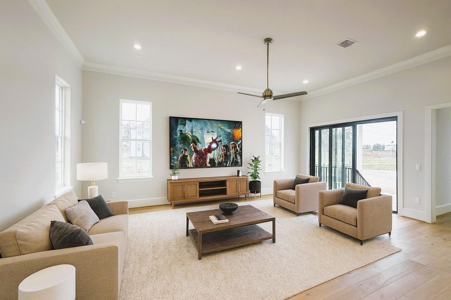 Complete Openness - 12 FT Living Room Ceilings dressed with Double Crown Molding -Tri-Paneled Glass Doors Open to a Fenced-in Back Patio (Picture was Virtually Staged) Complete Openness - 12 FT Living Room Ceilings dressed with Double Crown Molding -Tri-Paneled Glass Doors Open to a Fenced-in Back Patio (Picture was Virtually Staged)