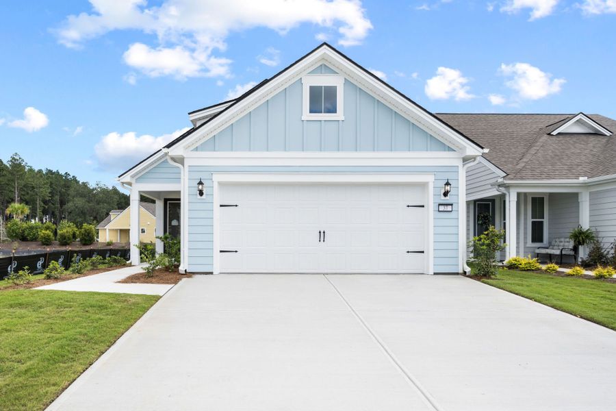 Front exterior of a new home in Del Webb Savannah at Heartwood, Richmond Hill, GA, highlighting curb appeal (Image 2). Front exterior of a new home in Del Webb Savannah at Heartwood, Richmond Hill, GA, highlighting curb appeal (Image 2).