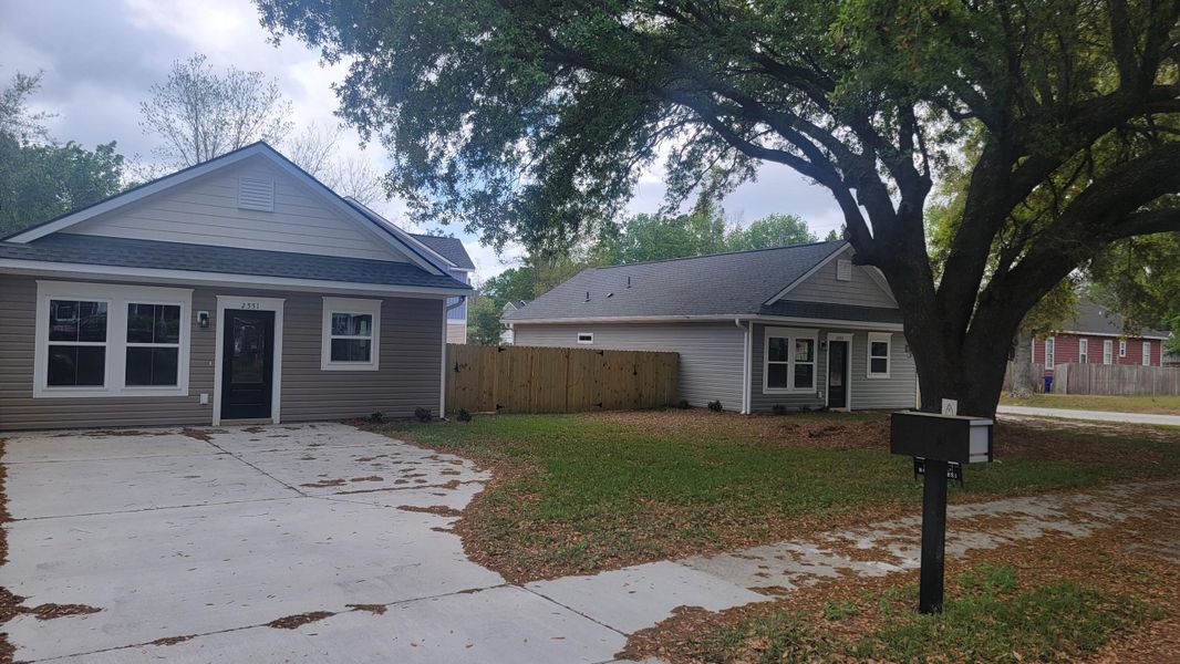 Front exterior of a new home in , North Charleston, SC, highlighting curb appeal (Image 13).