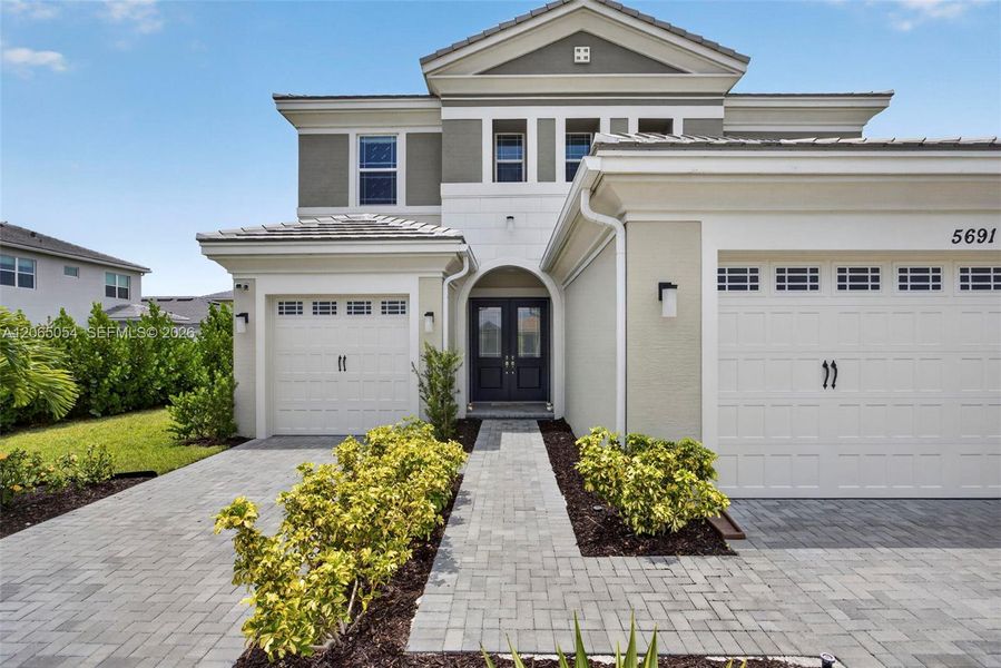 Front exterior of a new home in , Westlake, FL, highlighting curb appeal (Image 22).
