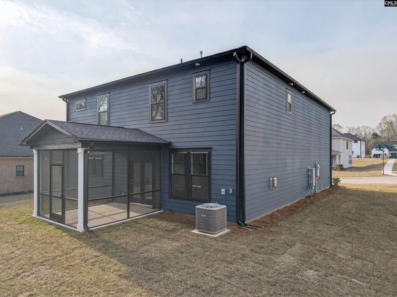 Exterior details and patio area of a home in Collins Cove, Chapin (Image 35).