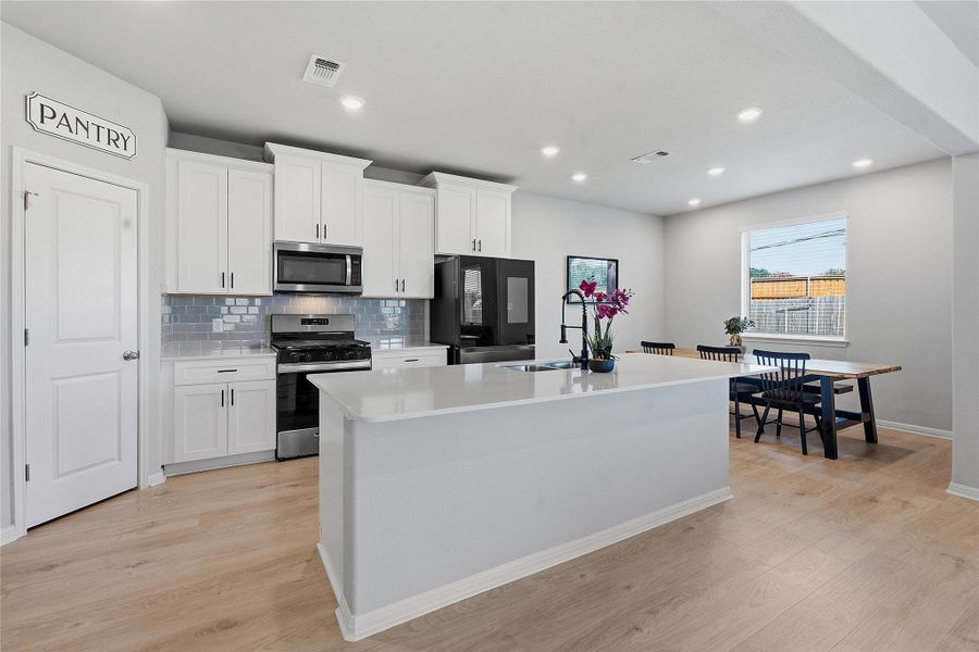Furnished interior view inside a new home in Crosswinds, Kyle (Image 8).