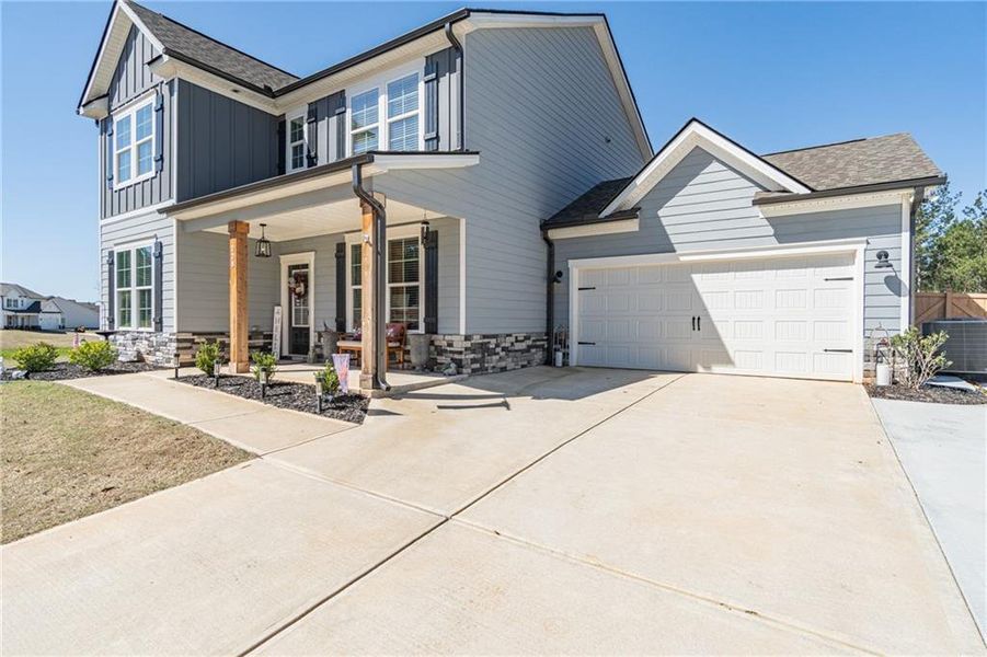 Front exterior of a new home in River Station, Monroe, GA, highlighting curb appeal (Image 25).