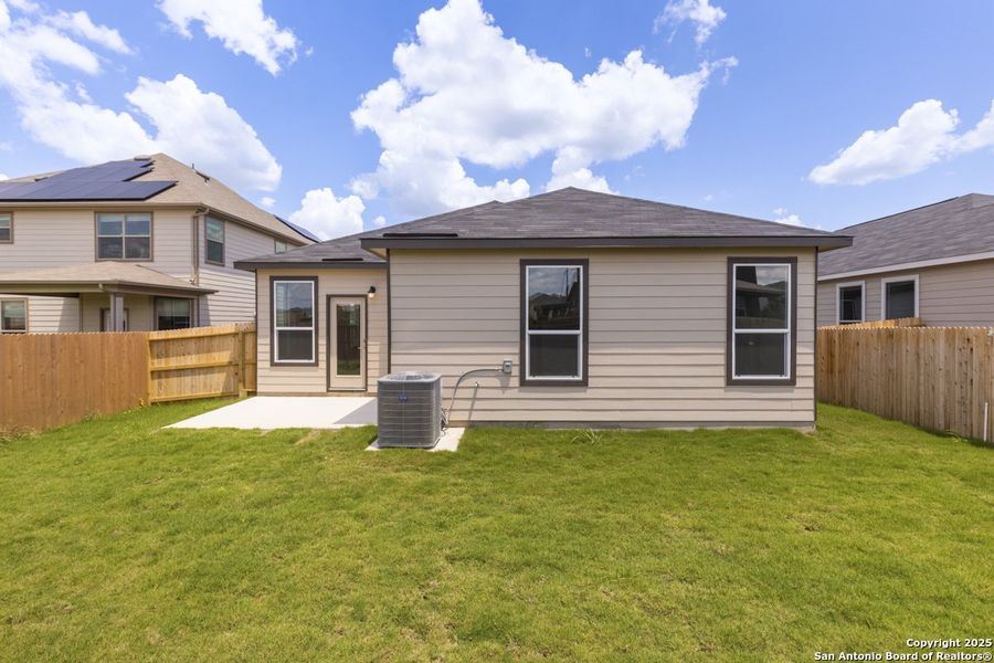 Front exterior of a new home in Woodside Farms, Seguin, TX, highlighting curb appeal (Image 18).