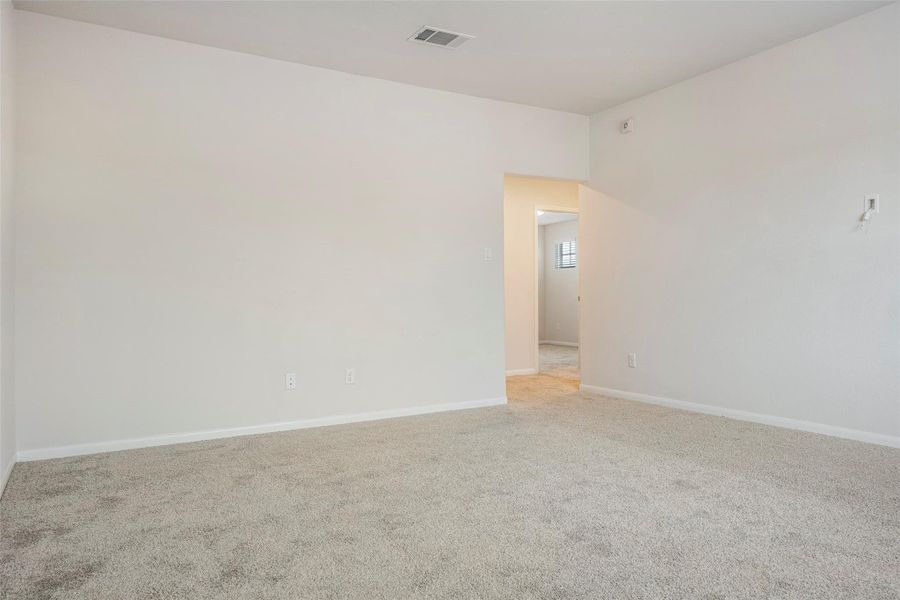 Spacious, unfurnished interior of a new home in Sunterra, Katy (Image 37).