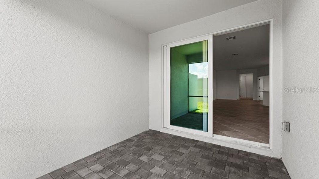 Exterior details and patio area of a home in Palm Lake at Coco Bay, Englewood (Image 3).